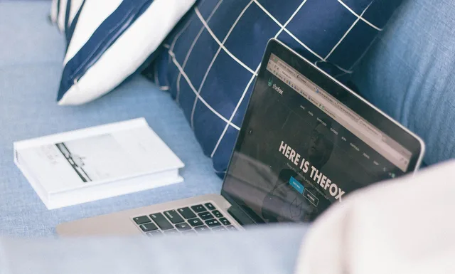 couch, sofa, book, pillow, laptop, computer, macbook, modern, technology, gadget, electronics, browser, blue book, blue books, blue couch. How to audit JavaScript rendering issues for technical SEO on UK news sites